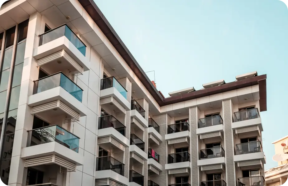 Multi-story condo building with tiered balconies
