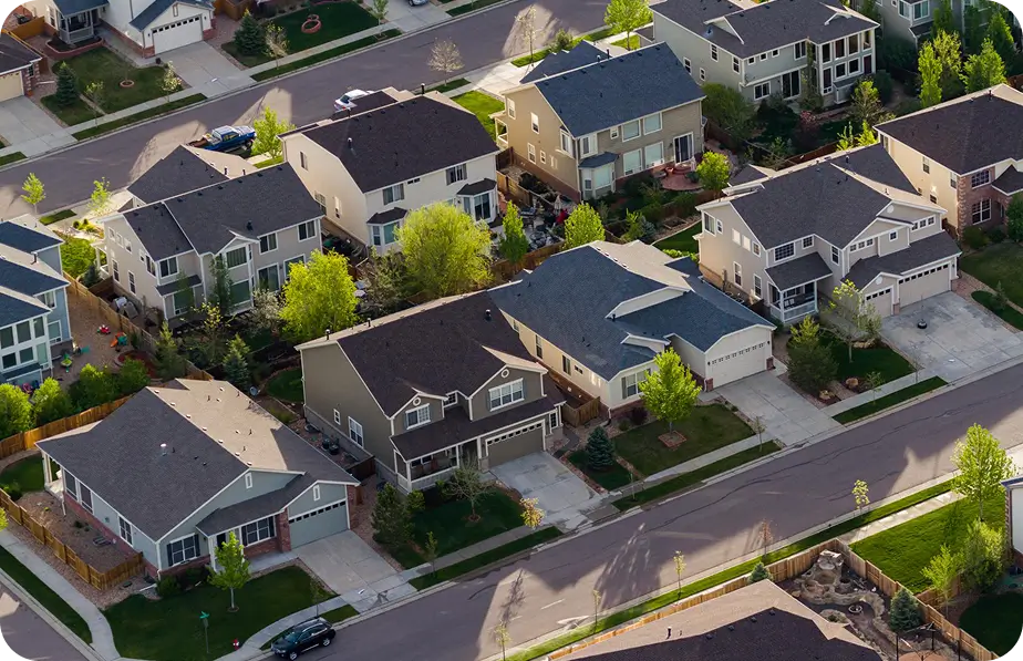 Aerial view of a residential community with well-maintained rooftops