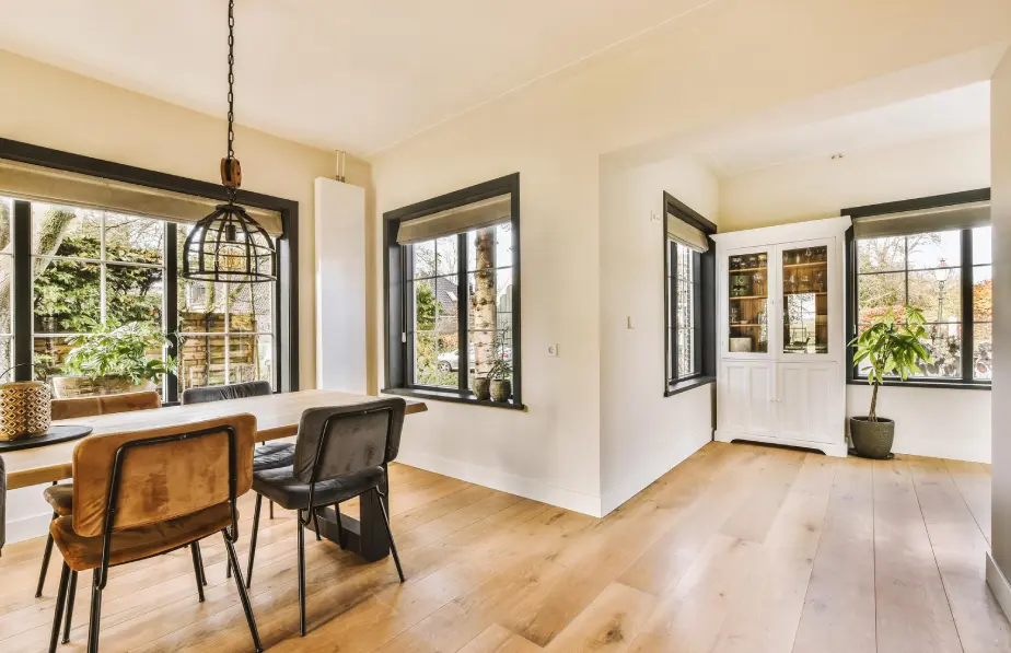 Bright dining room with freshly painted white walls and trim