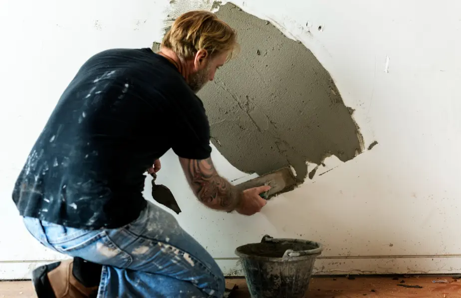Roller refreshing a scuffed interior wall